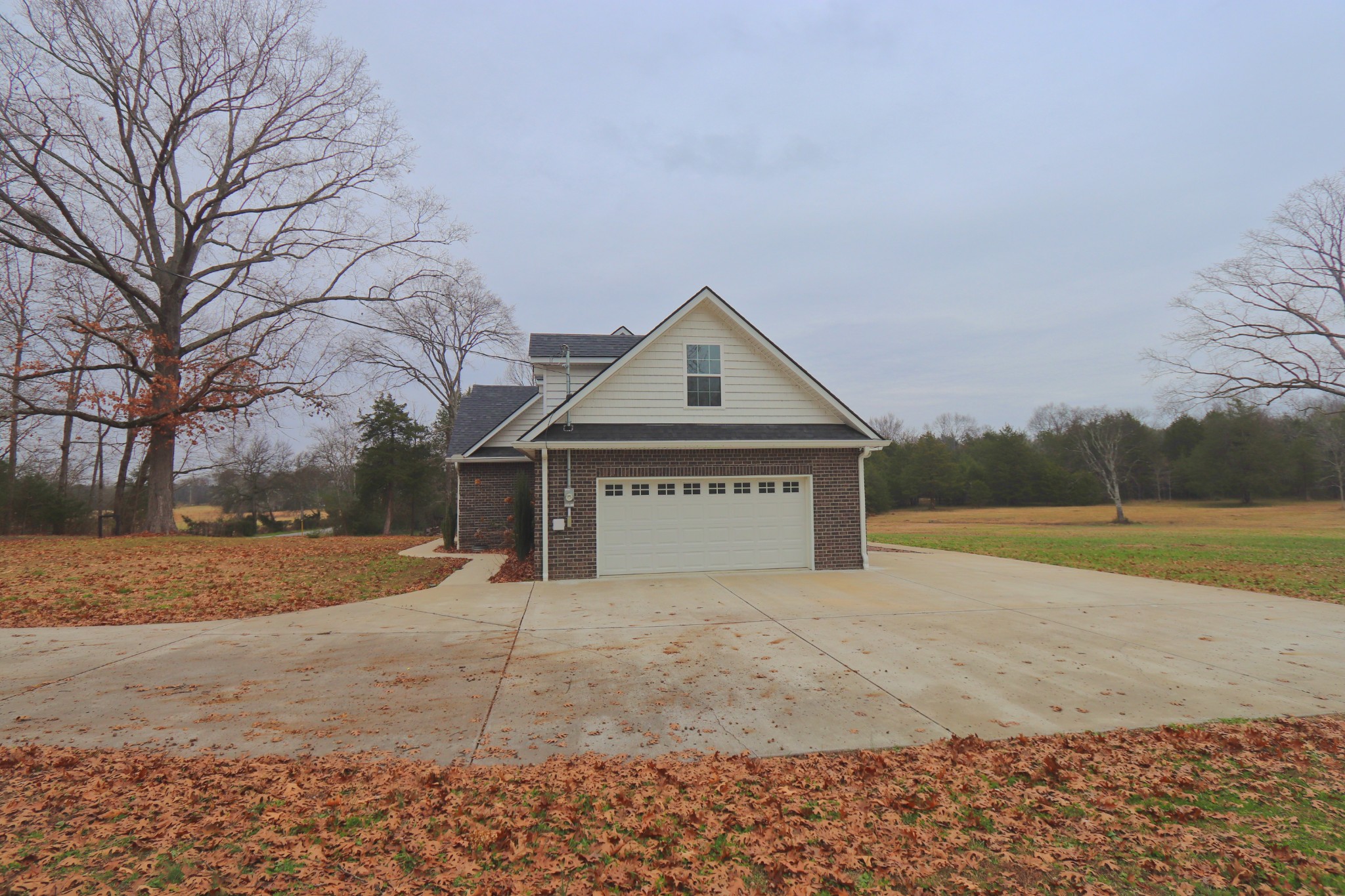 395 Harrison Road Shelbyville, TN 37160 - Photo 7 of 30 a view of house with yard and large trees