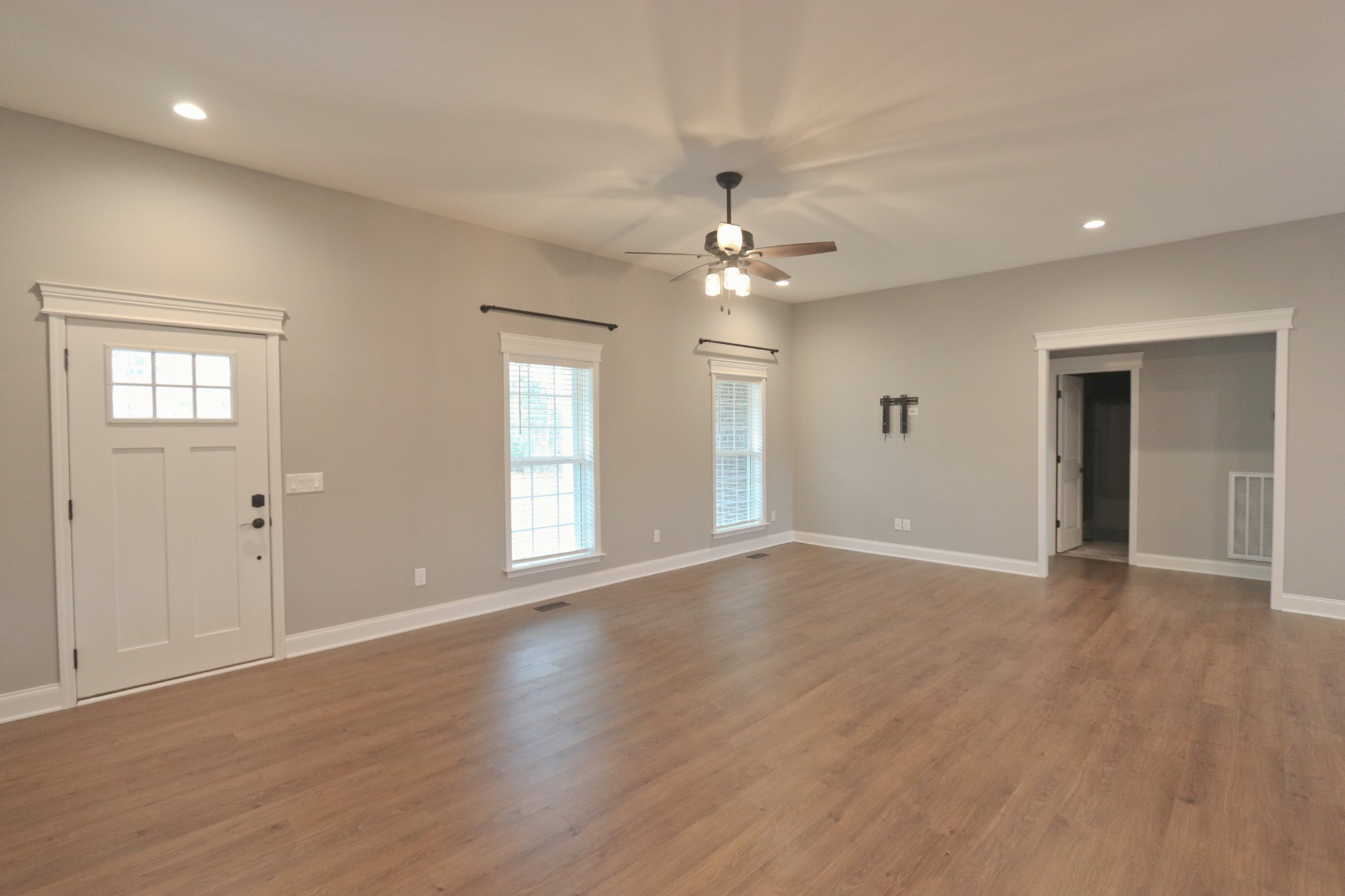 395 Harrison Road Shelbyville, TN 37160 - Photo 8 of 30 a view of an empty room with window and wooden floor