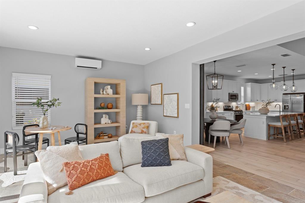 8057 Tidal Pointe Way Sarasota, FL 34240 - Photo 12 of 27 a living room with furniture and a large window