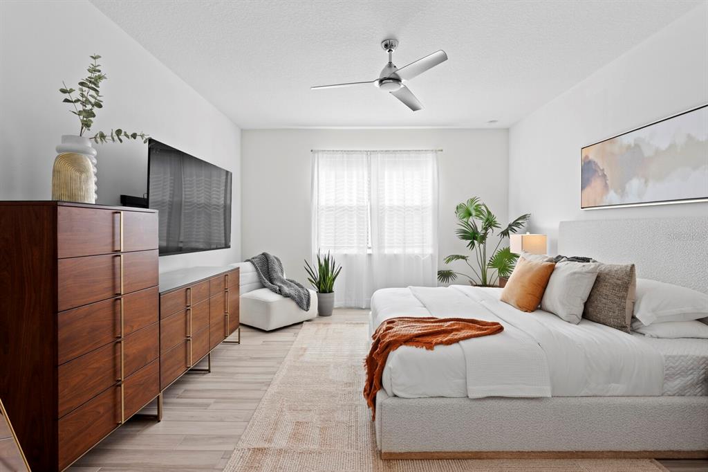 8057 Tidal Pointe Way Sarasota, FL 34240 - Photo 13 of 27 a bedroom with a bed and window