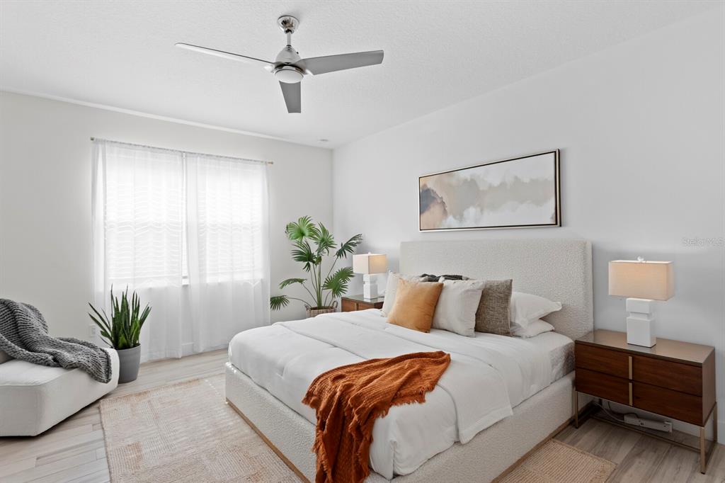 8057 Tidal Pointe Way Sarasota, FL 34240 - Photo 14 of 27 a bedroom with bed and window