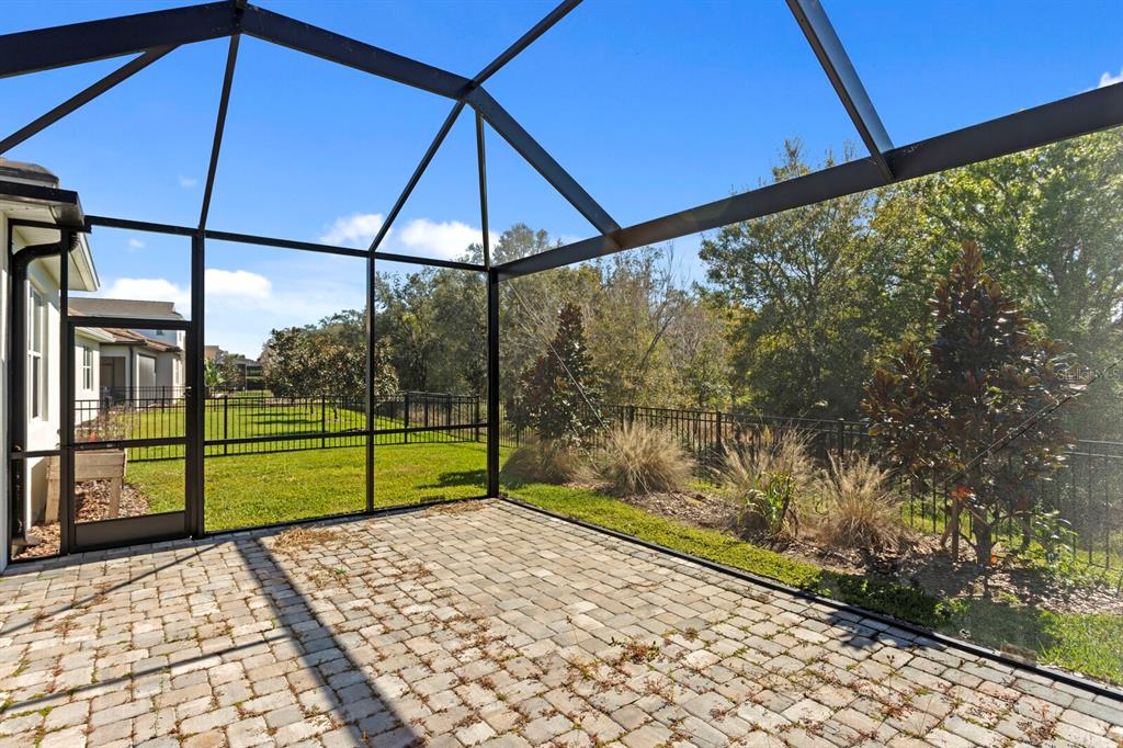 8057 Tidal Pointe Way Sarasota, FL 34240 - Photo 24 of 27 a view of a small yard next to a yard