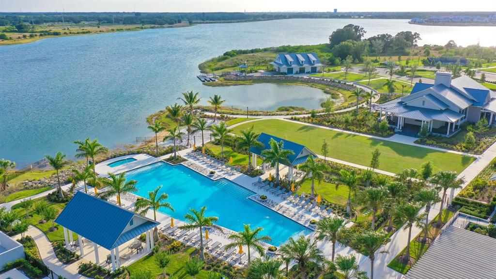 8057 Tidal Pointe Way Sarasota, FL 34240 - Photo 27 of 27 a view of a swimming pool with a yard