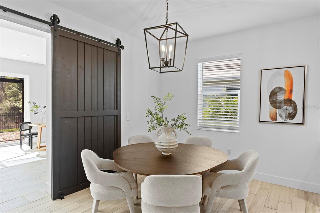 8057 Tidal Pointe Way Sarasota, FL 34240 - Photo 8 of 27 a dining room with furniture and window