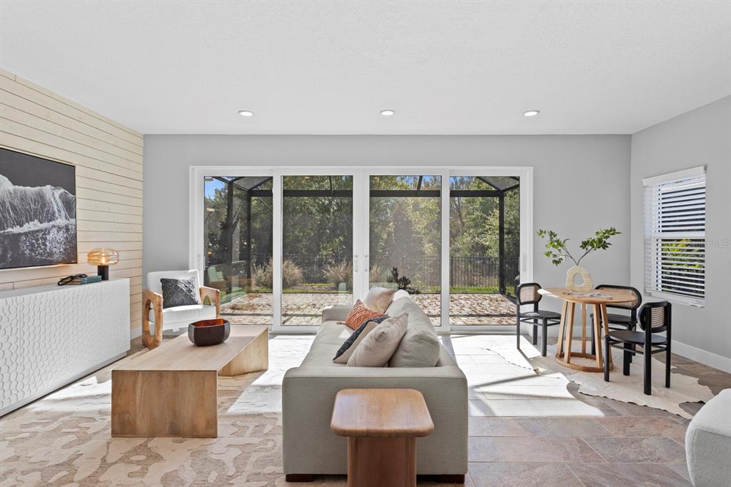 8057 Tidal Pointe Way Sarasota, FL 34240 - Photo 10 of 27 a living room with furniture and large windows