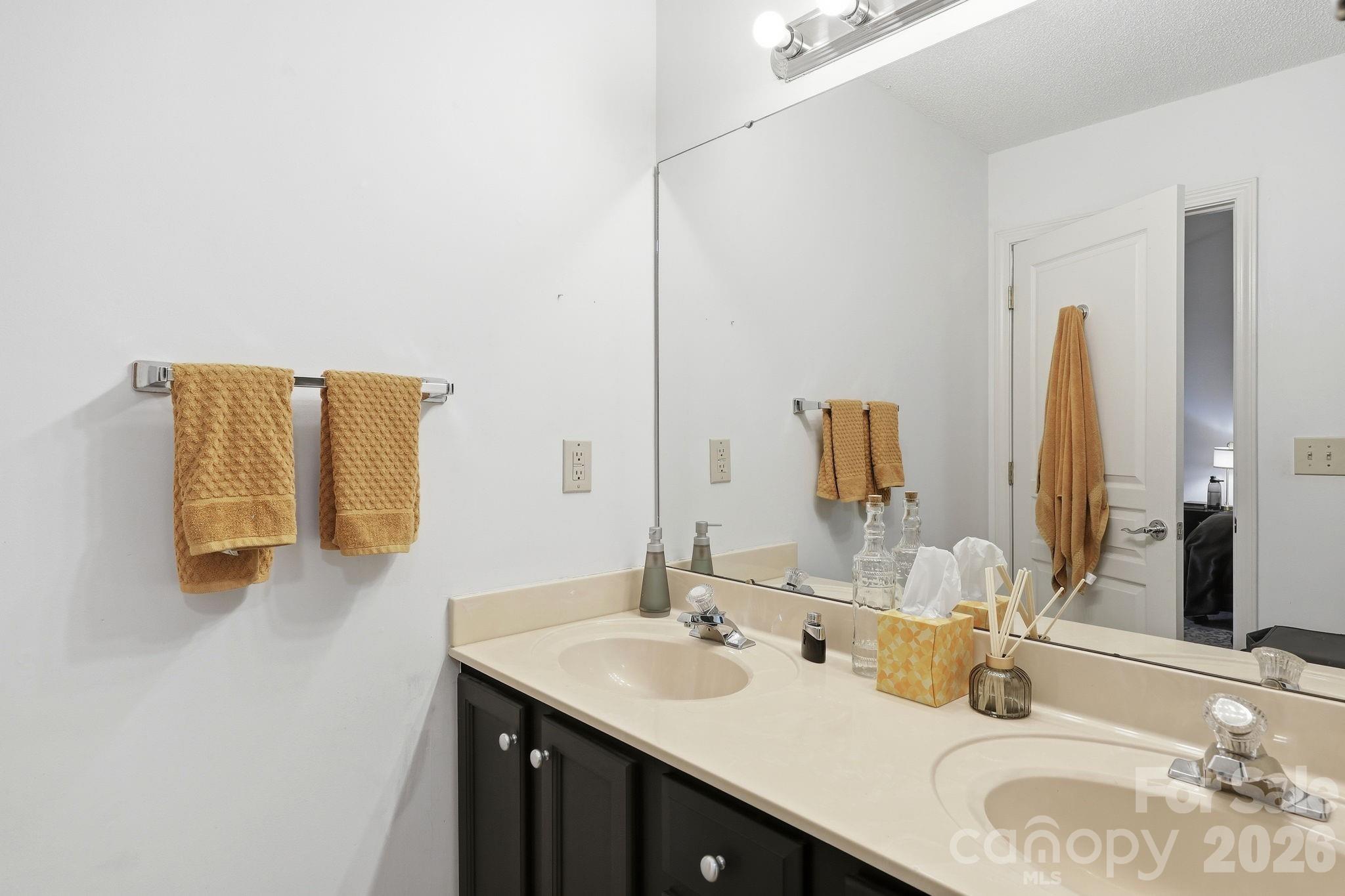 51 Sunview Circle Arden, NC 28704 - Photo 20 of 31 a bathroom with a granite countertop sink and a mirror