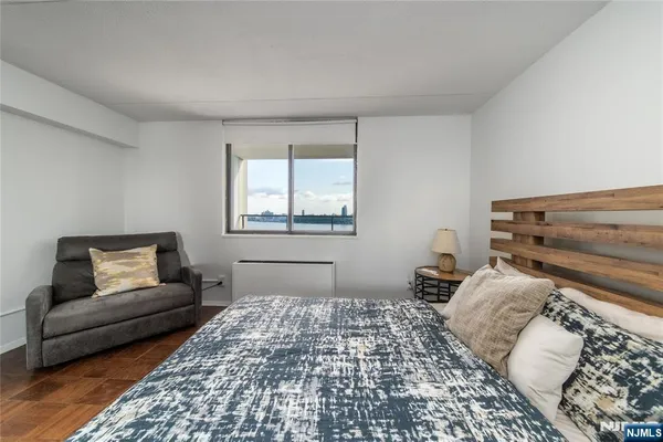 a bedroom with a bed and utility room