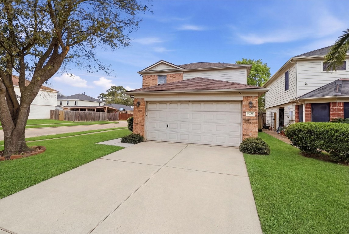 15403 Apple Bloom Way Channelview, TX 77530 - Photo 2 of 25 a front view of a house with a yard