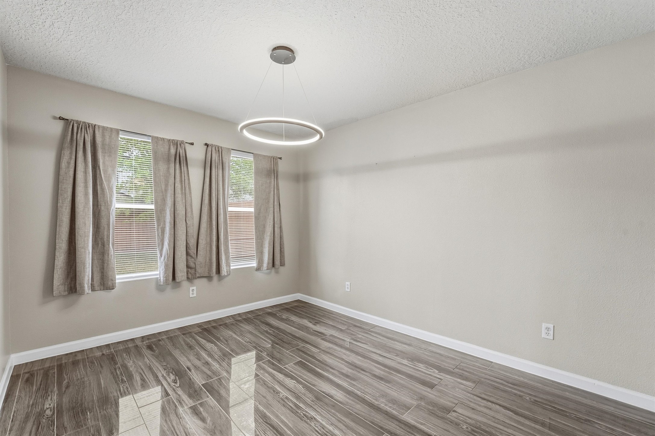 15403 Apple Bloom Way Channelview, TX 77530 - Photo 22 of 25 a view of empty room with wooden floor and fan