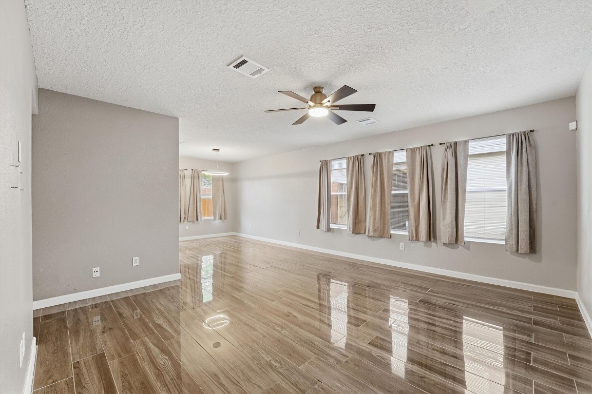 15403 Apple Bloom Way Channelview, TX 77530 - Photo 4 of 25 a view of an empty room with a window and wooden floor