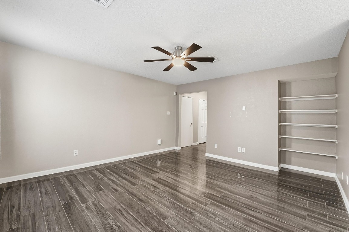 15403 Apple Bloom Way Channelview, TX 77530 - Photo 6 of 25 a view of an empty room with a window and wooden floor