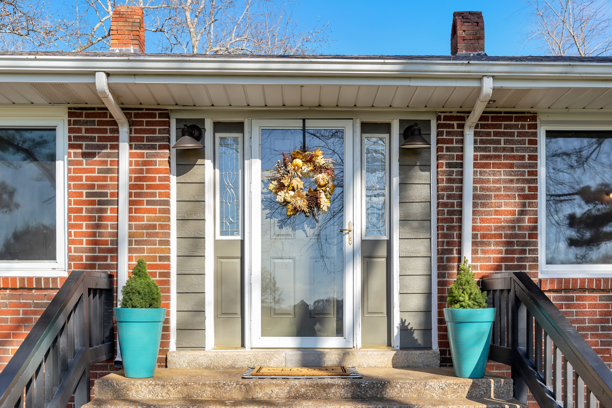 5774 Bending Chestnut Road Franklin, TN 37064 - Photo 2 of 17 a front view of a building with a potted plant