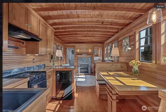 a living room with stainless steel appliances kitchen island granite countertop furniture and a kitchen view