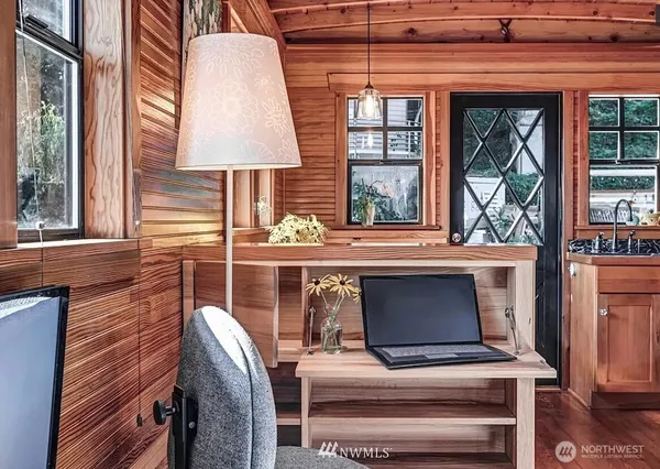 a view of a lake with a table and chairs