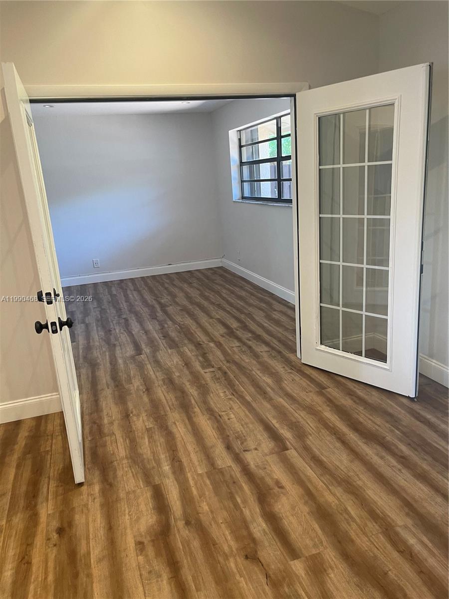11269 Southwest 116th Terrace, Unit 11269 Miami, FL 33176 - Photo 5 of 11 an empty room with windows