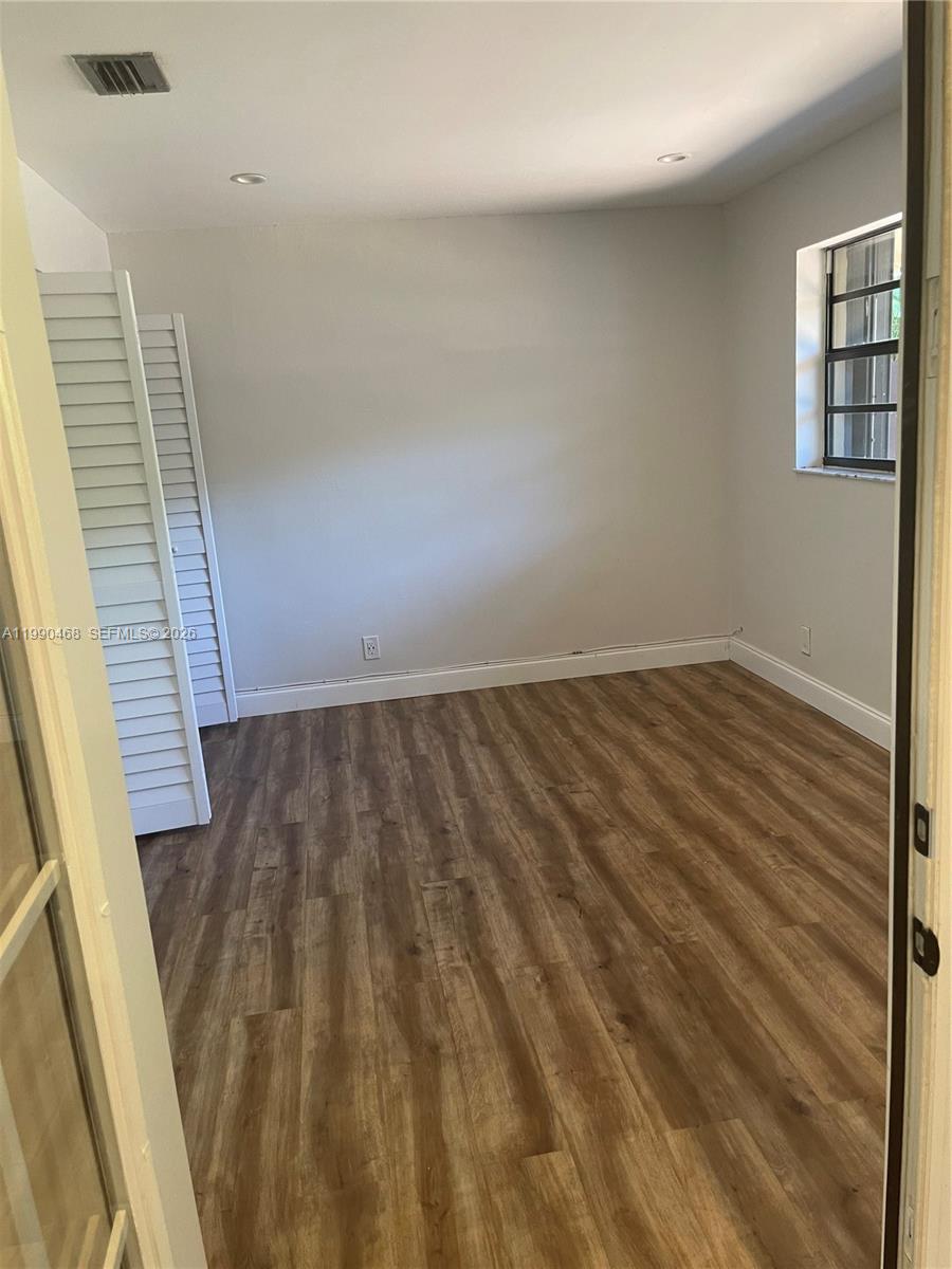 11269 Southwest 116th Terrace, Unit 11269 Miami, FL 33176 - Photo 6 of 11 a view of wooden floor in an empty room
