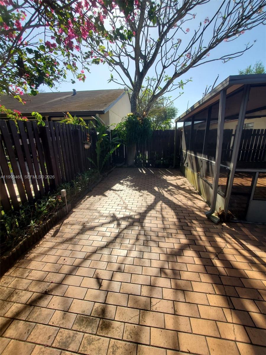 11269 Southwest 116th Terrace, Unit 11269 Miami, FL 33176 - Photo 10 of 11 a view of backyard with wooden fence
