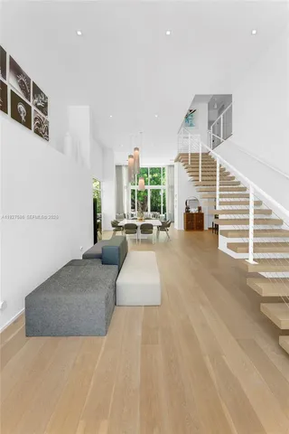 a view of a living room with a wooden floor