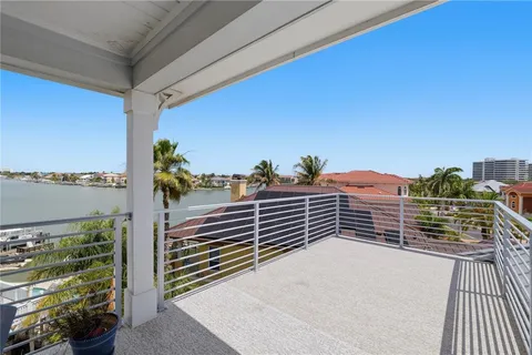 a view of a chairs and table on the deck