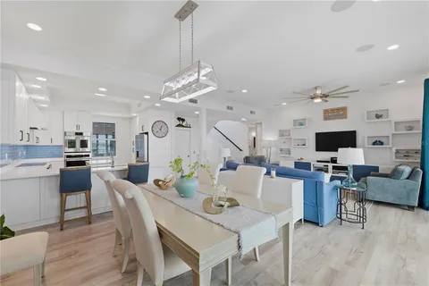 a bedroom with a bed and a lamp on dresser