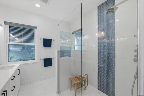 an aerial view of a house with a swimming pool