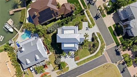a view of a chair and tables front of the house