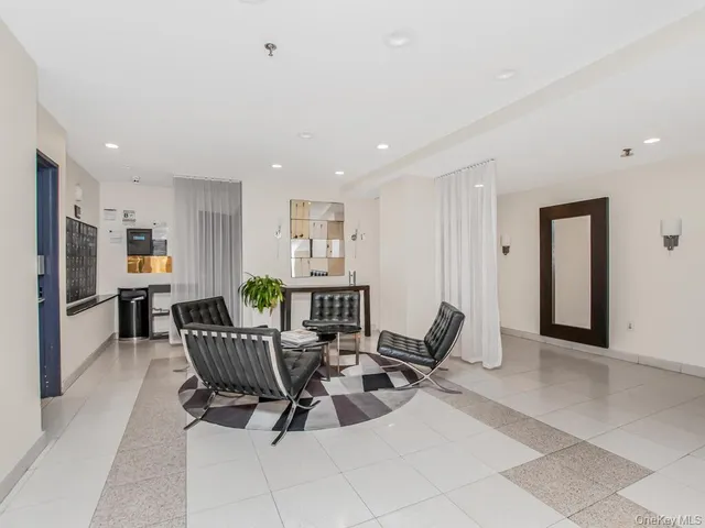 a living room with furniture a dining table and chairs