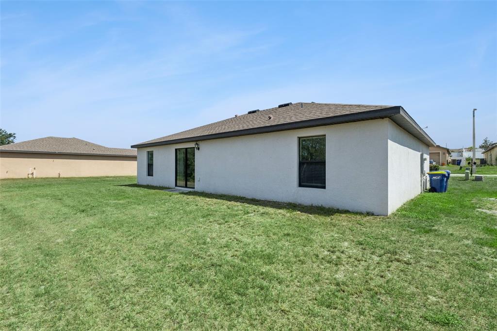 1613 Orne Street Mascotte, FL 34753 - Photo 24 of 31 a house with a outdoor space