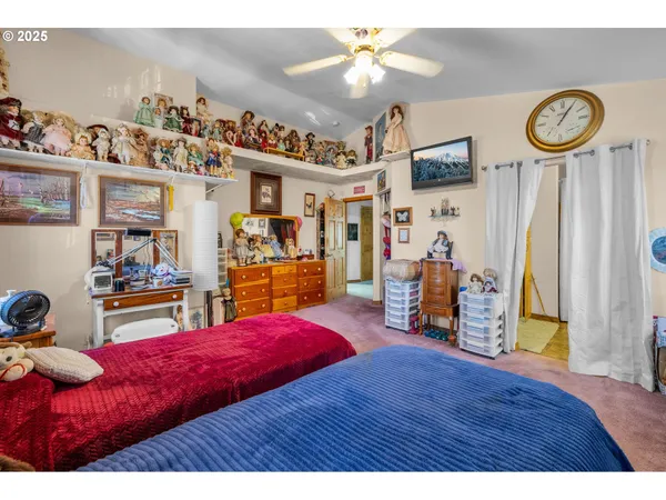 a view of a room with workspace and toys