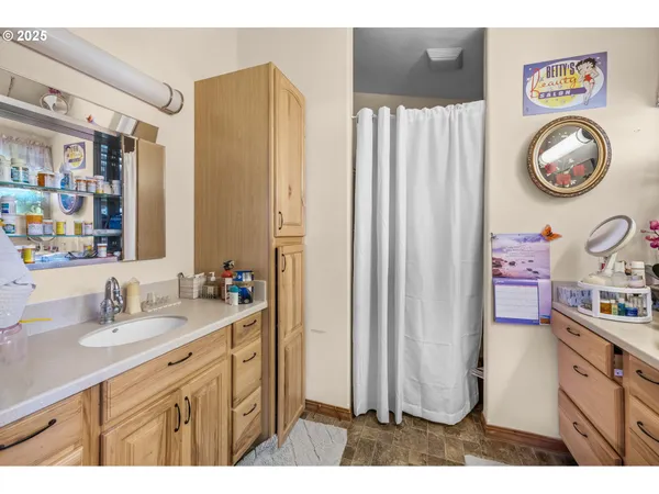 a bathroom with a sink and a mirror