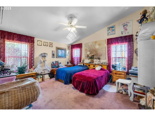 a bedroom with bed and window