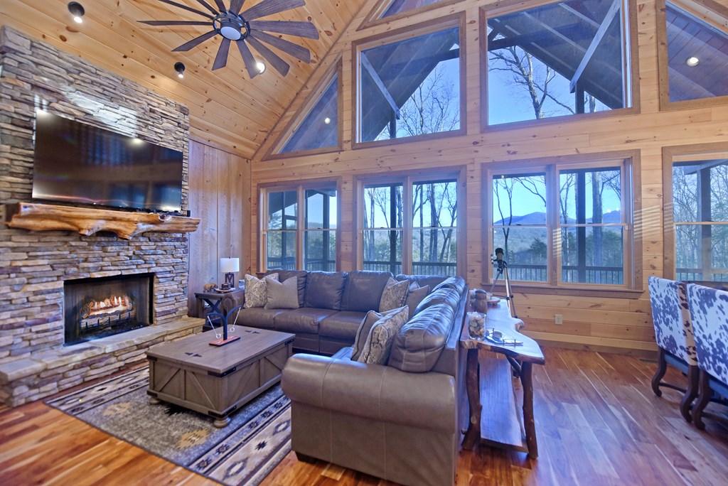 306 Native Trail Cherry Log, GA 30522 - Photo 22 of 65 a living room with furniture a flat screen tv and a fireplace