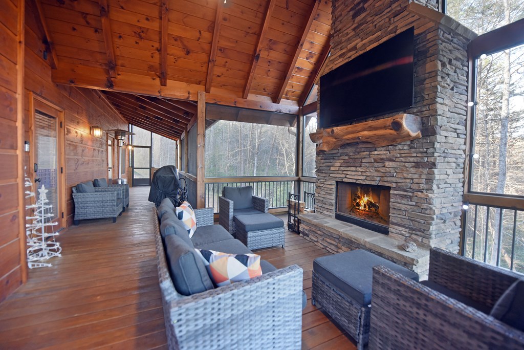 306 Native Trail Cherry Log, GA 30522 - Photo 29 of 65 a outdoor living space with patio furniture and a fireplace