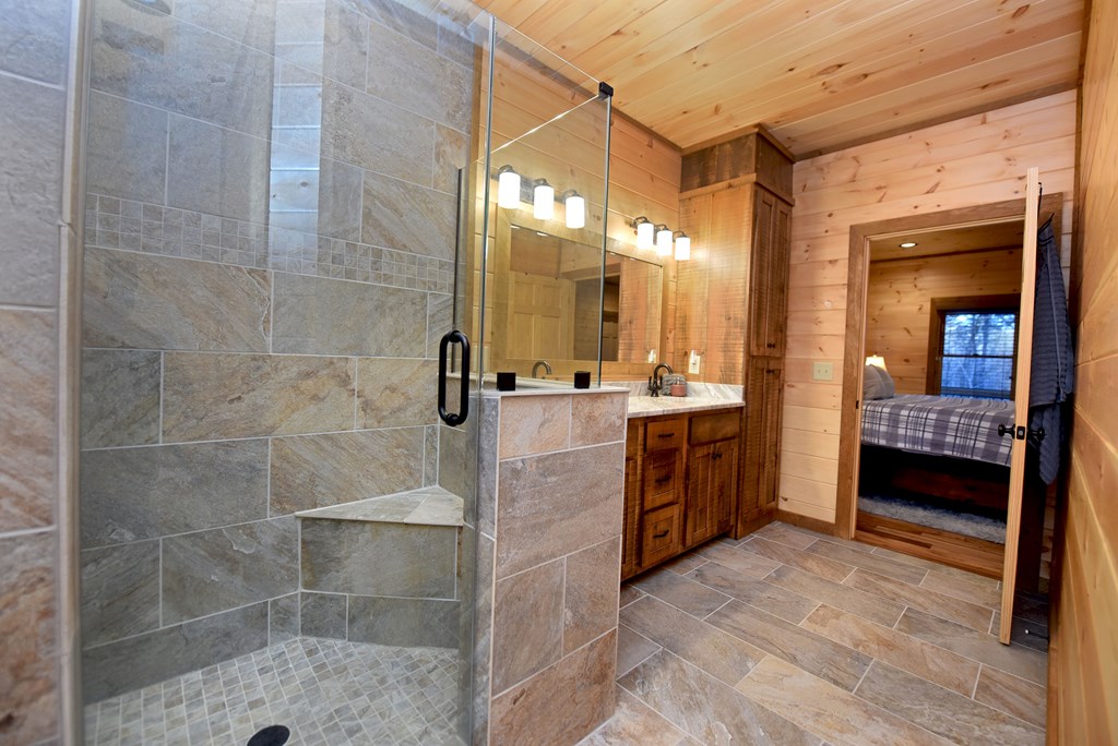 306 Native Trail Cherry Log, GA 30522 - Photo 42 of 65 a bathroom with a double vanity sink a toilet and shower