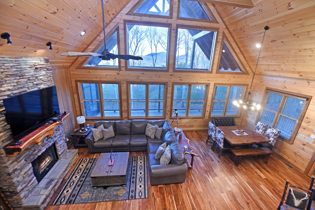 306 Native Trail Cherry Log, GA 30522 - Photo 43 of 65 a living room with furniture a fireplace and a flat screen tv