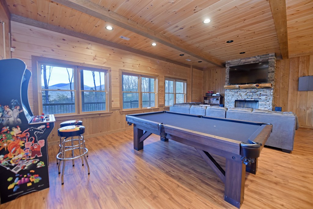 306 Native Trail Cherry Log, GA 30522 - Photo 51 of 65 a living room with furniture a flat screen tv and floor to ceiling window