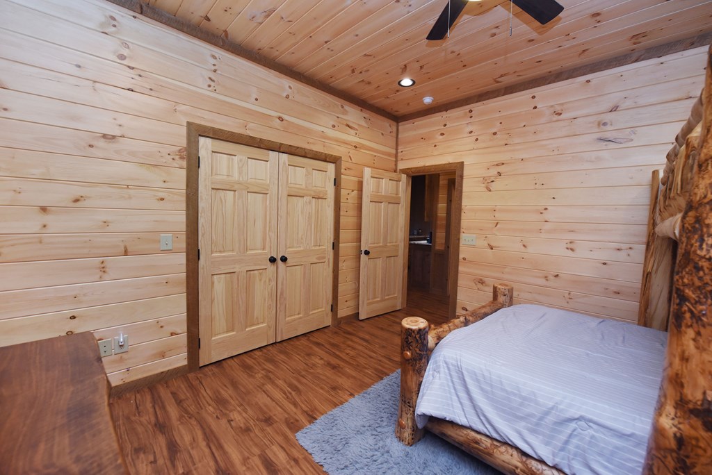 306 Native Trail Cherry Log, GA 30522 - Photo 58 of 65 a bedroom with a bed and wooden floor
