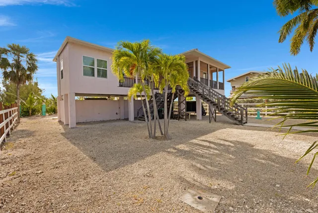 a view of a swimming pool with a patio and a garden