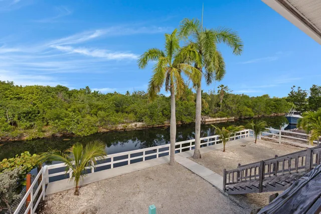 a view of outdoor space with swimming pool and furniture
