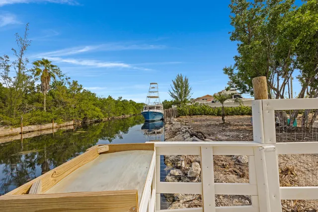 a view of a chair and tables in the patio