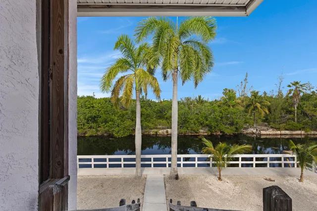 aerial view of a house with a yard