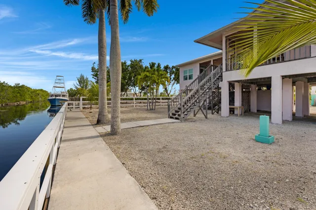 a view of a balcony with chairs