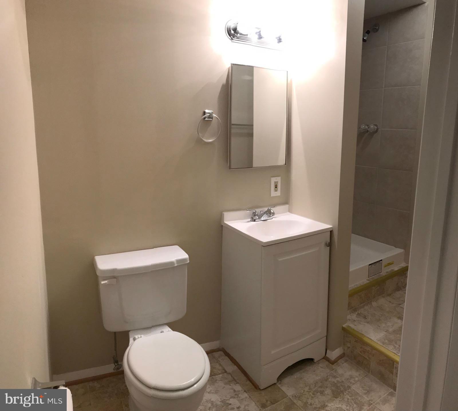10408 Apple Ridge Road Gaithersburg, MD 20886 - Photo 14 of 14 a bathroom with a toilet sink and mirror