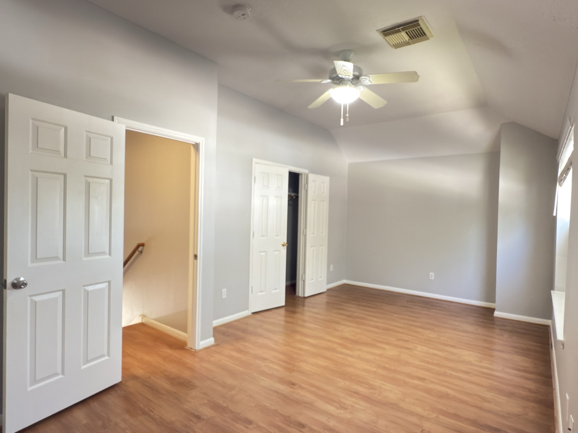 14431 Andrea Way Lane Houston, TX 77083 - Photo 11 of 20 wooden floor in an empty room with a mirror