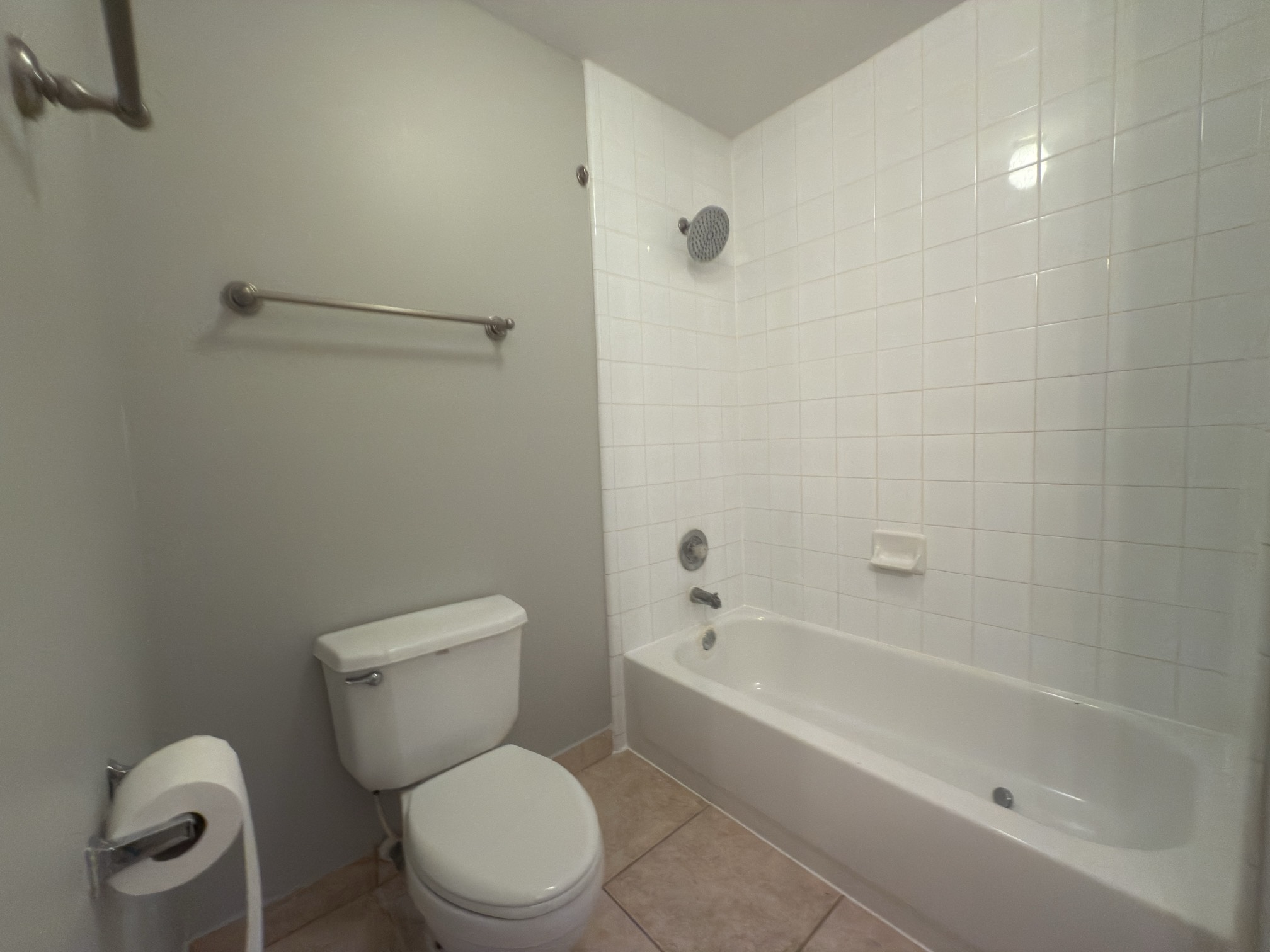 14431 Andrea Way Lane Houston, TX 77083 - Photo 17 of 20 a white toilet sitting next to a bath tub
