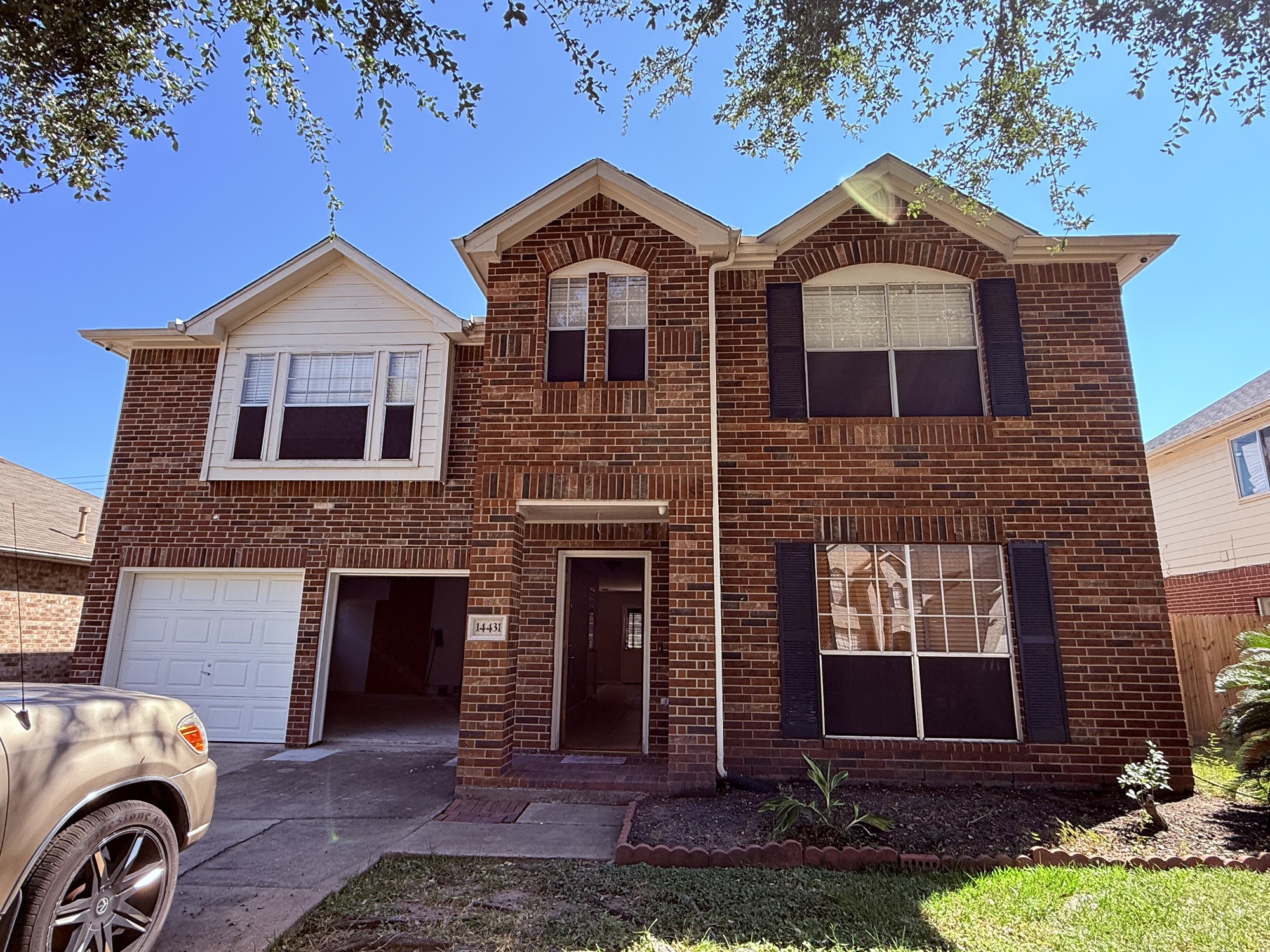 14431 Andrea Way Lane Houston, TX 77083 - Photo 2 of 20 a front view of a house with garden