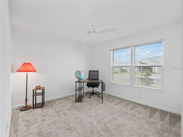 a work room with furniture and a window