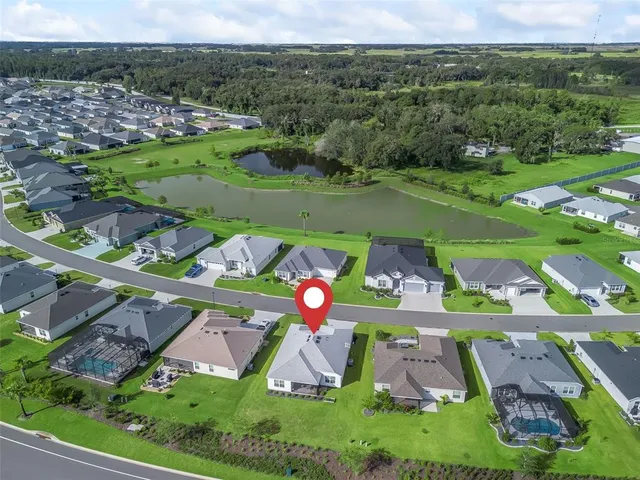 an aerial view of a golf course with outdoor space