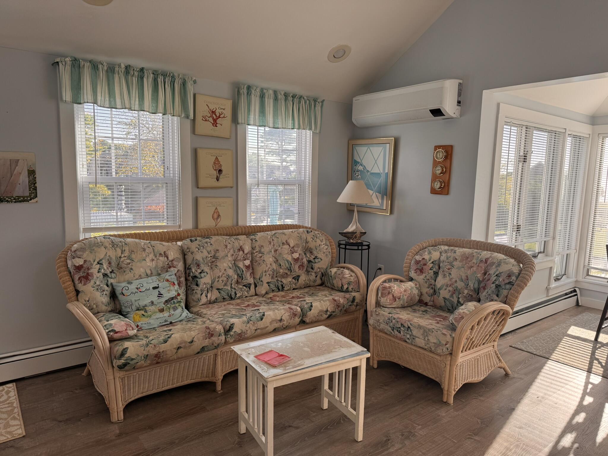 11 Brant Rock Road, Unit 11 Mashpee, MA 02649 - Photo 3 of 9 a living room with furniture and a large window