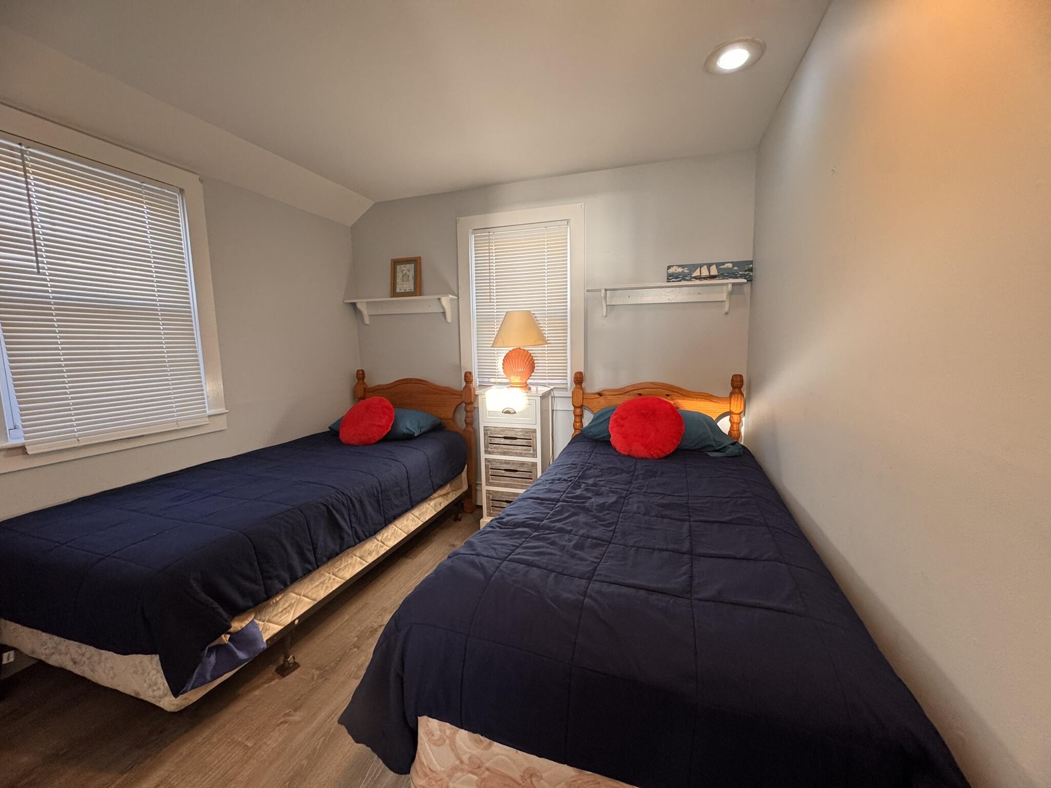 11 Brant Rock Road, Unit 11 Mashpee, MA 02649 - Photo 9 of 9 a bedroom with a bed and window